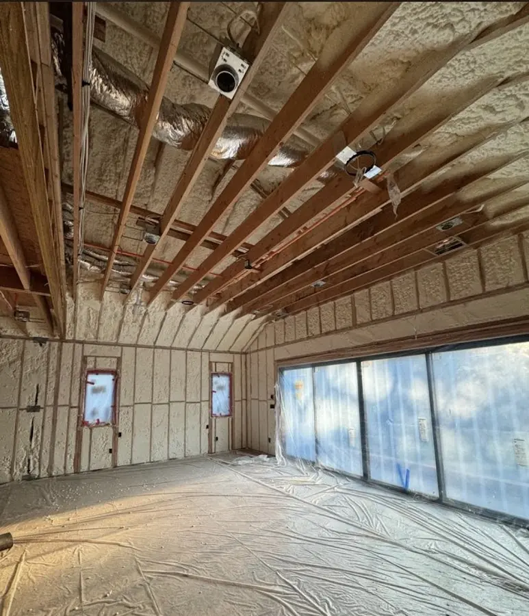 Interior walls and ceiling insulated with spray foam during new construction in Olive